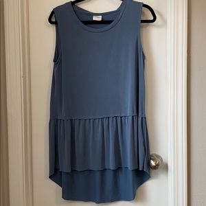 Hi-low sleeveless top with ruffled hemline